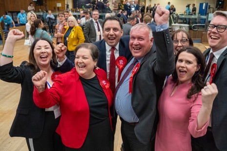 Davy Russell, the new Labour MP for Hamilton, Larkhall and Stonehouse (centre, right) with Scottish Labour leader Anas Sarwar (centre) and deputy leader Jackie Baillie (centre, left) and other colleagues celebrating after Russell’s victory was announced.