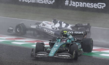 Sebastian Vettel (front) and Pierre Gasly (behind) veer off the track in the rain at Suzuka.