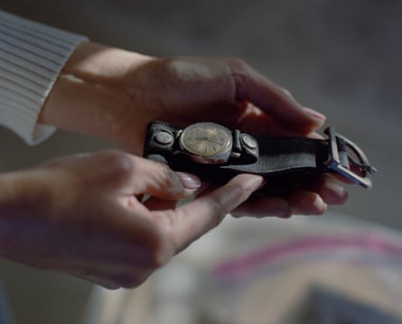 Hands holding an old watch