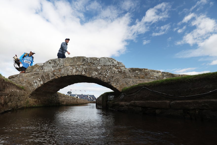 Rory McIlroy walks across the Swilcan Bridge on the 18th hole during a practice round at St Andrews on Wednesday