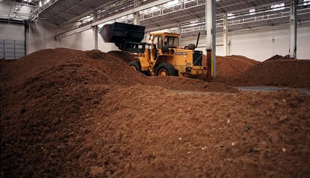 Bulldozer moving a mountain of ground beef.