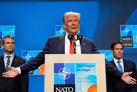 Donald Trump spreads his arms at a Nato-branded lectern, flanked by Pete Hegseth and Marco Rubio