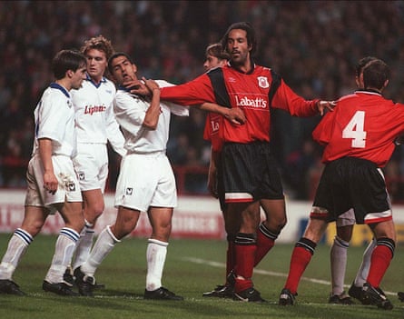 Jason Lee of Nottingham Forest pushes Auxerre’s Sabri Lamouchi.