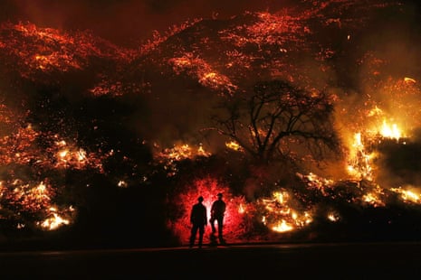 On 7 December firefighters monitor a section of the huge Thomas Fire along the 101 freeway north of Ventura, California, which devastated thousands of acres and destroyed hundreds of homes
