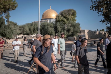 Israelis walk near the Dome of the Rock at al-Aqsa mosque compound in Jerusalem