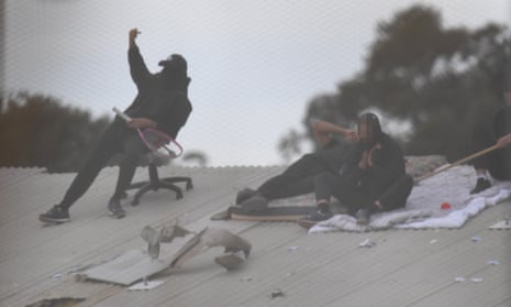 Detainees are seen on the roof during a riot at the Frank Baxter juvenile justice centre on the NSW central coast.