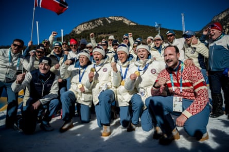 Norway’s jubilant 4x7.5km men’s cross-country skiing team with their gold medals, including multi-winning Johannes Høsflot Klæbo (second right), accompanied by team members and Norwegian prime minister Jonas Gahr Støre (second left) and Crown Prince Haakon (right)