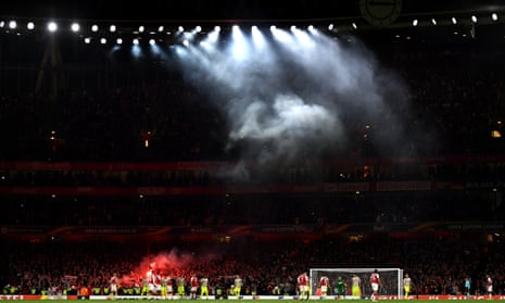 Smoke from the flares let off by the Cologne fans, swirls around the Emirates.