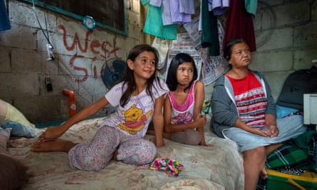 Brigette Sicat, 10, above left, with her cousin Arianne, 11, and her grandmother Juana.