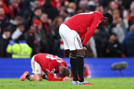 Kobbie Mainoo (right) sinks to his knees at full time