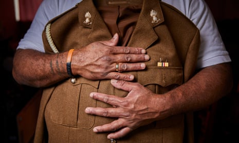 Fijian-born soldier holding uniform