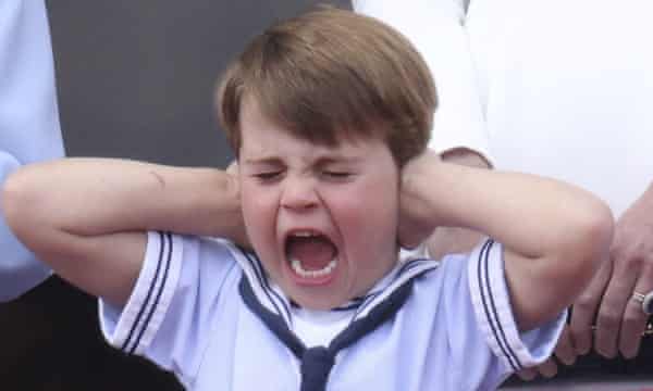 Prince Louis, in a sailor outfit, reacts during the flypast on the balcony of Buckingham Palace in London.