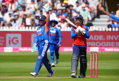 England’s Sophia Dunkley is caught by India’s Richa Ghosh.