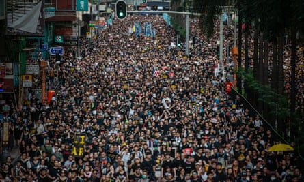 Demonstrators march in Hong Kong on Sunday.