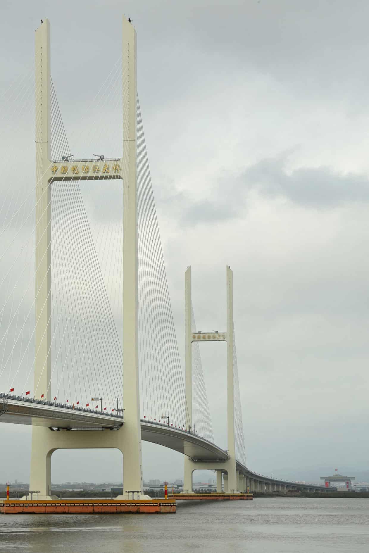 The New Yalu River Bridge’s cable-stayed towers span the river linking China and North Korea