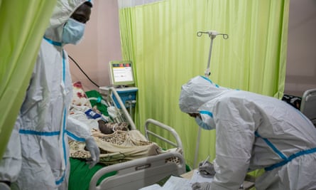 Health workers attend to a Covid-19 patient at Jabra Central hospital in Khartoum