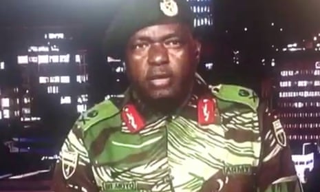 A member of Zimbabwe’s military delivers a statement after troops took control of the state broadcaster