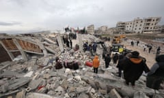 Rescuers search for survivors trapped under the rubble in north-western Syria