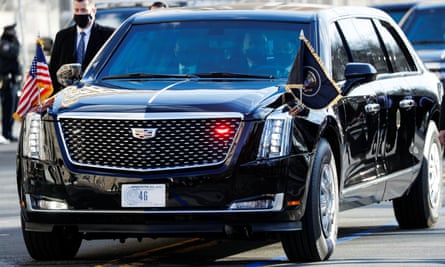 Joe Biden travelling in the presidential limousine, known as the Beast