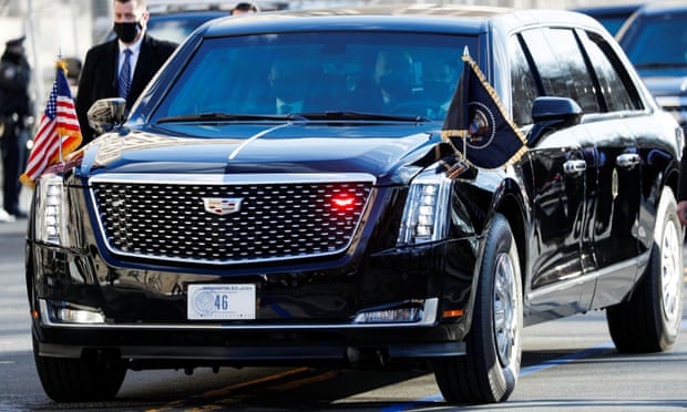 Biden travelling in the presidential limousine, known as the Beast.
