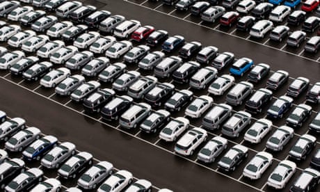 aerial view of new cars in a lot