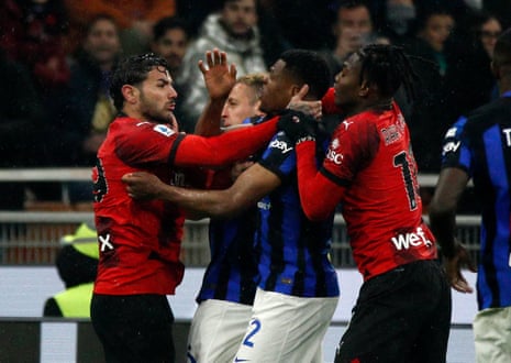 Milan's Theo Hernandez and Inter's Denzel Dumfries clash before both players are shown a red card.
