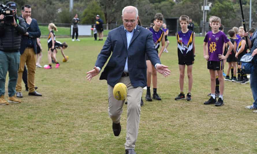 Prime Minister Scott Morrison kicks a ball at Norwood Sports Club on Day 34 of the 2022 federal election campaign, in Norwood in Melbourne, in the seat of Deakin. Saturday, May 14, 2022. (AAP Image/Mick Tsikas)