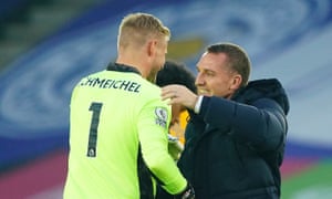 Brendan Rodgers goes to hug Kasper Schmeichel after the win against Wolves that took Leicester top