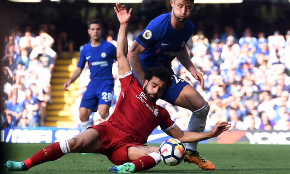Liverpool’s Mohamed Salah goes to ground under a challenge from Chelsea’s Gary Cahill