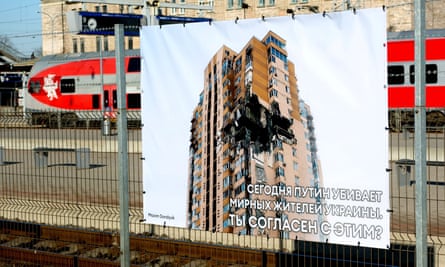 A poster of a damaged building at Vilnius railway station