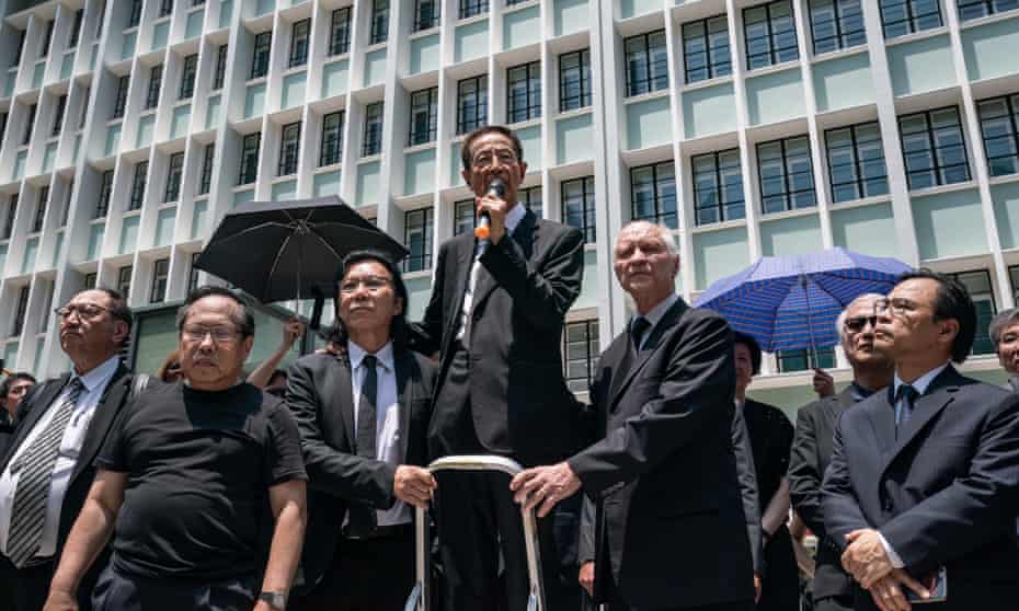 Martin Lee Chu-ming, a Hong Kong politician and barrister, speaks outside the department of justice. 