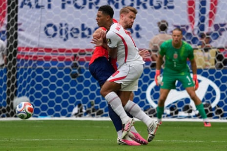 Jude Bellingham is fouled by Kristoffer Ajer on the edge of the box.