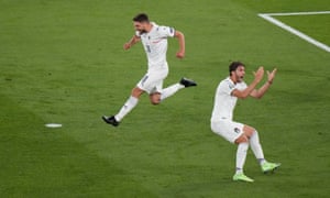 Domenico Berardi and Manuel Locatelli celebrate after Turkey’s Merih Demiral scores an own goal and the first for Italy.