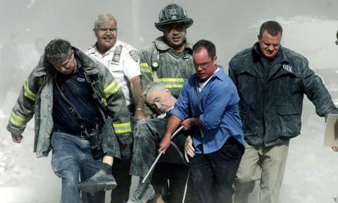 Rescue workers carry Father Mychal Judge, the fire department chaplain, from one of the World Trade Center towers on September 11, 2001.