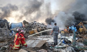 Firefighters work at the scene of the explosion