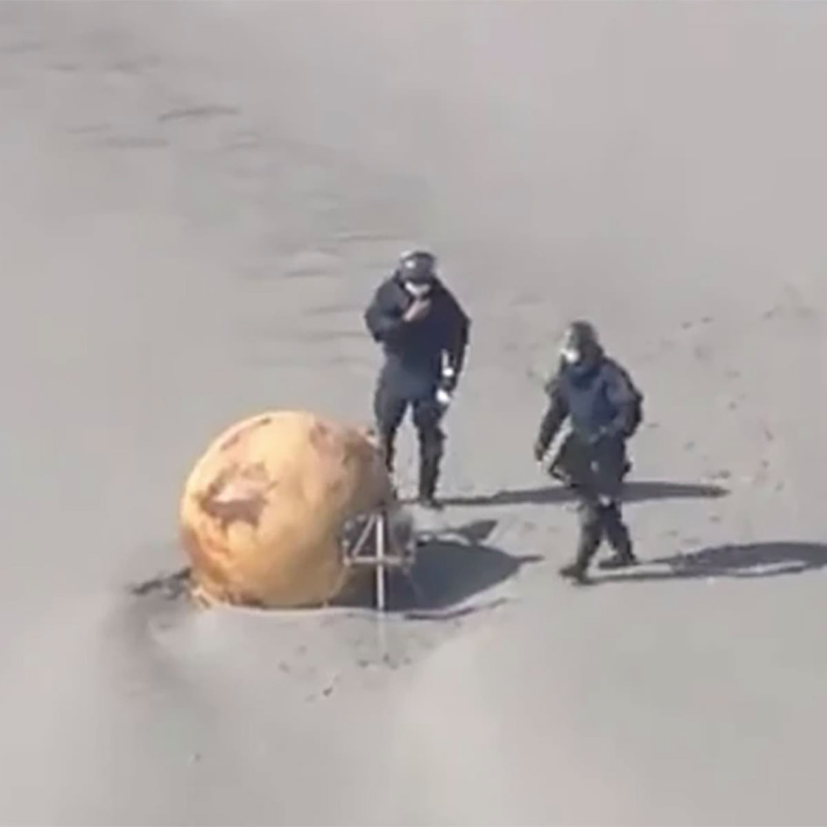 Spy balloon, UFO or Dragon Ball? Japan baffled by iron ball washed up on beach | Japan | The Guardian