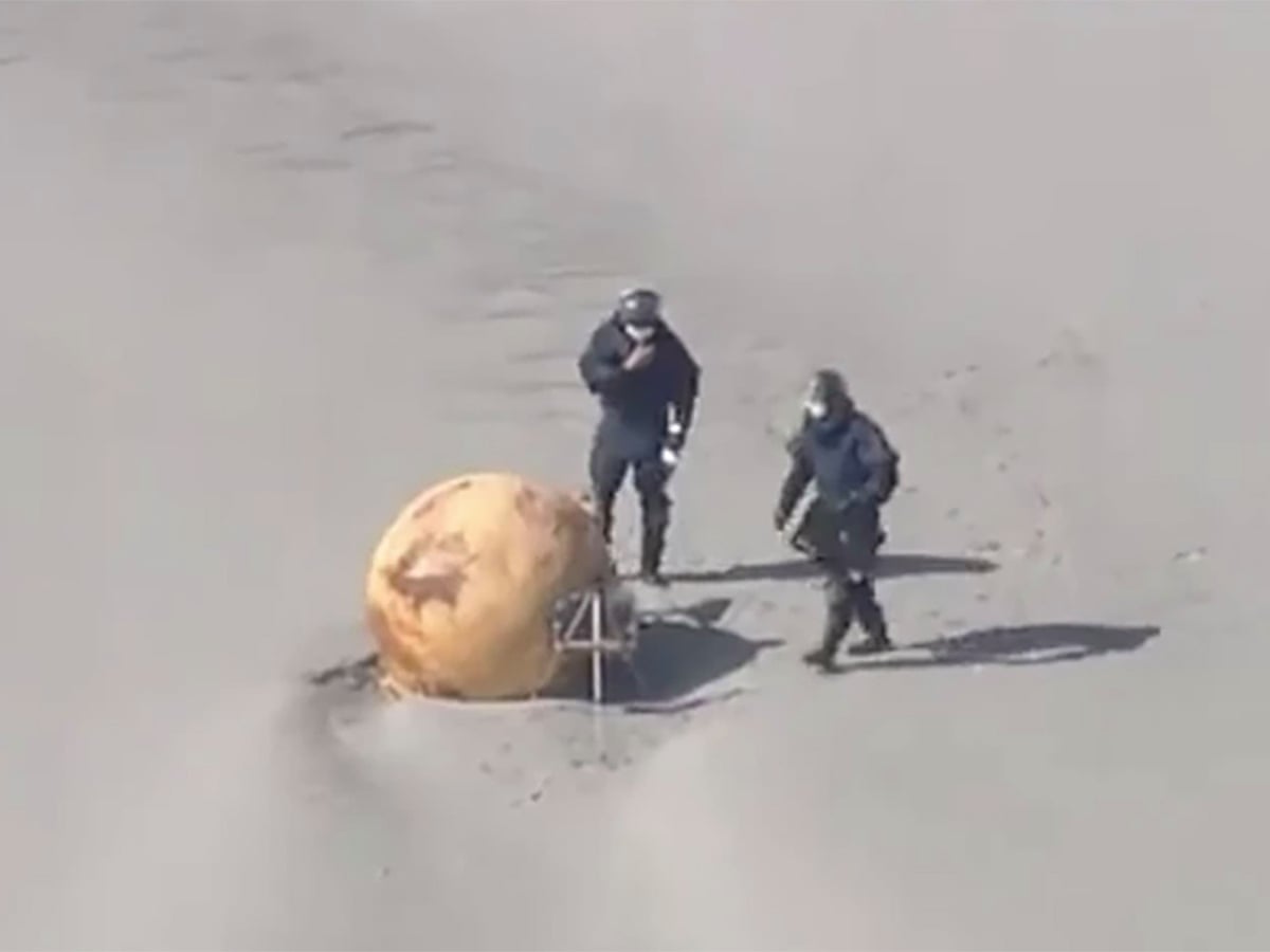 Spy balloon, UFO or Dragon Ball? Japan baffled by iron ball washed up on beach | Japan | The Guardian