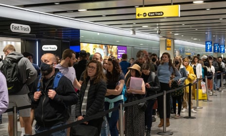 Travellers in a queue for security at Heathrow airport, 1 June 2022.