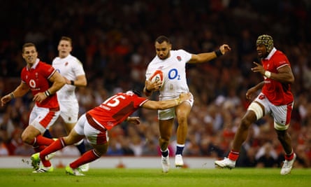 England's Joe Marchant is tackled by Wales's Leigh Halfpenny