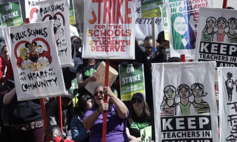 Teachers and supporters rally in front of city hall in Oakland, California, on 21 February.
