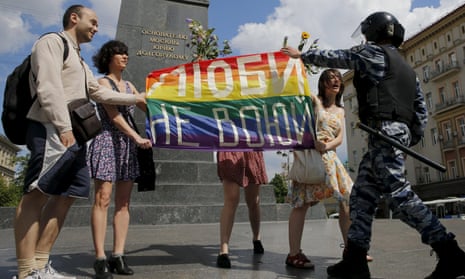A policeman objects to protestors holding a rainbow flag during an LGBT community rally in central Moscow, Russia, at the weekend. The sign reads, “Love. Don’t make war.” The UN report says at least 76 countries have laws used to criminalise and harass people on the basis of their sexual orientation.
