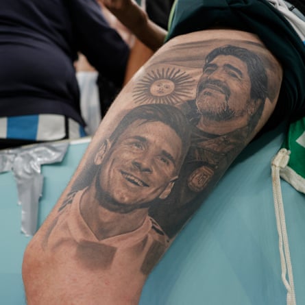 A fan with a tattoo depicting Lionel Messi and Diego Maradona.