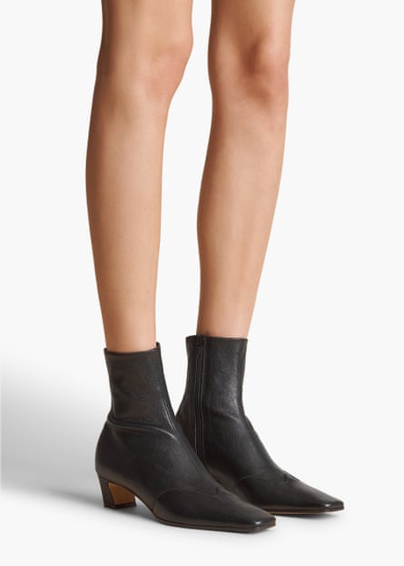 A model wearing Khaite Neada Stretch Low Boot