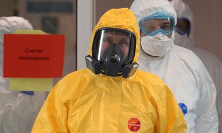 Vladimir Putin wearing a yellow hazmat suit inspecting Moscow’s main coronavirus hospital in March.