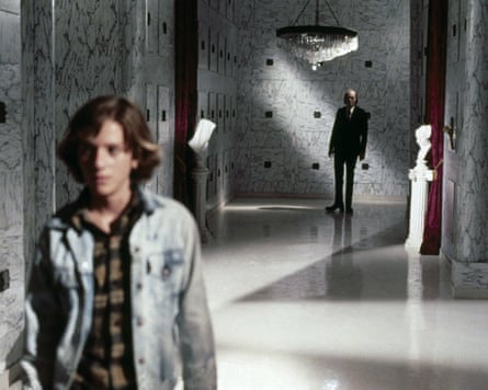 two men in marble corridor