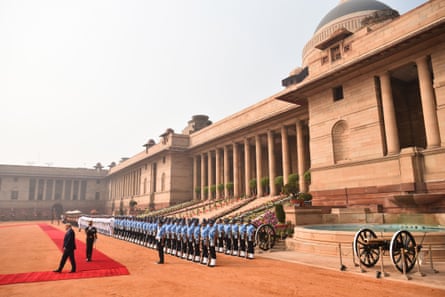 Donald Trump reviews a guard of honour during a ceremonial reception at Rashtrapati Bhavan.