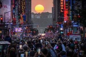 The sun sets in alignment with the Manhattan streets, from east to west