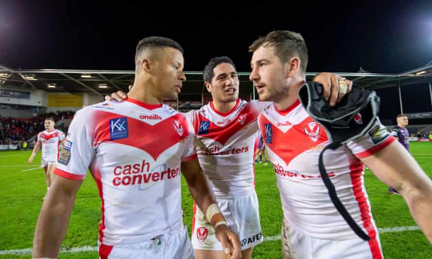 Regan Grace, Sione Mata'utia and Mark Percival of St Helens celebrate after beating Leeds to reach the grand final