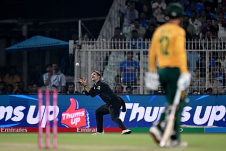 Lockie Ferguson takes a catch to dismiss South Africa's Quinton de Kock.