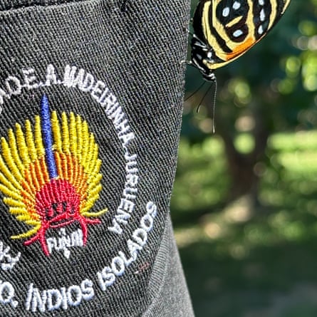 A butterfly lands on a Funai cap hanging out to dry at the base of Funai Kawahiva expedition.